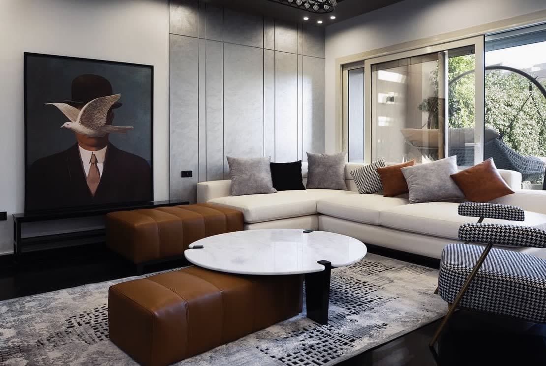 Palm Hills living room with cream sectional and garden view