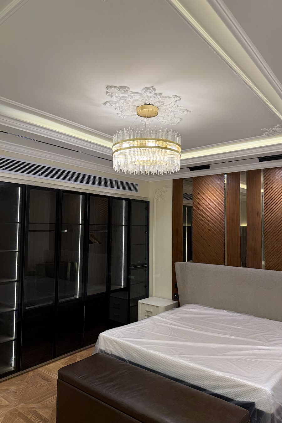 Hyde Park master bedroom with glass wardrobe wall