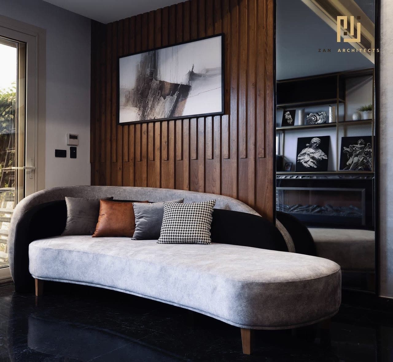 Palm Hills lounge with fluted timber wall and curved sofa
